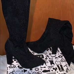 Thigh high sparky heels.